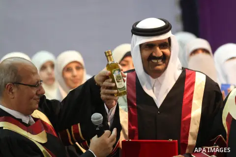 Qatari Emir Sheikh Hamad bin Khalifa al-Thani attends a celebration at the Islamic University in Gaza city on October 23, 2012. The Emir of Qatar entered the Gaza Strip on Tuesday for a visit that broke the isolation of...