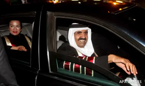 Qatari Emir Sheikh Hamad bin Khalifa al-Thani and his wife Sheikha Mozah bint Nasser al-Missned wave to the crowds as Gaza's Hamas prime minister Ismail Haniya drives in a car in Gaza City on October 23, 2012. The Emir o...