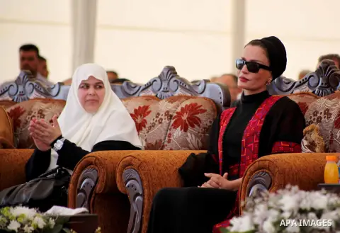 Qatar's First Lady Sheikha Mozah bint Nasser al-Missned sits with the wife of Gaza's prime minister Ismail Haniyah attend a cornerstone laying ceremony for Hamad, a new residential neighbourhood in Khan Younis in the sou...