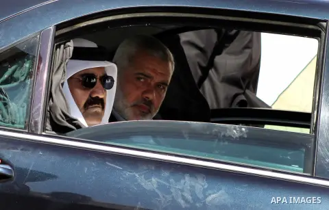 Palestinian Prime Minister in Gaza strip, Ismail Haniyeh and the Emir of Qatar Sheikh Hamad bin Khalifa al-Thani arrive at a cornerstone laying ceremony for Hamad, a new residential neighbourhood in Khan Younis in the so...