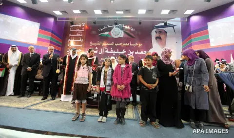 Qatari Emir Sheikh Hamad bin Khalifa al-Thani and Palestinian prime minister in Gaza strip, Ismail Haniyah attend a celebration at the Islamic University in Gaza city on October 23, 2012. The Emir of Qatar entered the Ga...