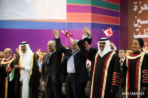 Qatari Emir Sheikh Hamad bin Khalifa al-Thani and Palestinian prime minister in Gaza strip, Ismail Haniyah attend a celebration at the Islamic University in Gaza city on October 23, 2012. The Emir of Qatar entered the Ga...