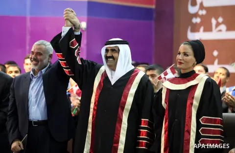 Qatari Emir Sheikh Hamad bin Khalifa al-Thani and Palestinian prime minister in Gaza strip, Ismail Haniyah attend a celebration at the Islamic University in Gaza city on October 23, 2012. The Emir of Qatar entered the Ga...