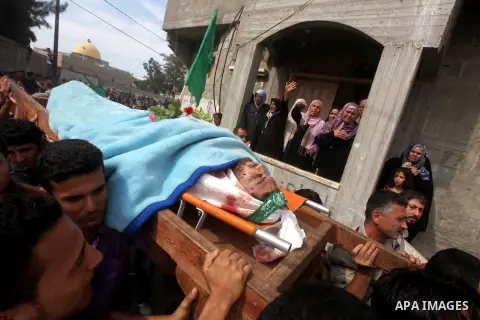 Palestinian mourners carry the body of Luay Abu Jarad during his funeral in Beit Lahiya in the northern Gaza Strip October 24, 2012. Israel killed a Hamas gunman in its second round of air strikes in as many days on the...