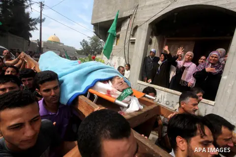 Palestinian mourners carry the body of Luay Abu Jarad during his funeral in Beit Lahiya in the northern Gaza Strip October 24, 2012. Israel killed a Hamas gunman in its second round of air strikes in as many days on the...