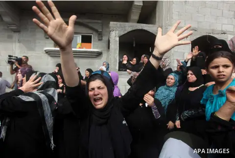 Palestinian relatives of Hamas gunman Loay Abu Jarad mourn during his funeral in Beit Lahiya in the northern Gaza Strip October 24, 2012. Israel killed a Hamas gunman in its second round of air strikes in as many days on...