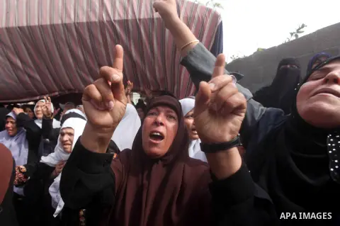 Palestinian relatives of Hamas gunman Loay Abu Jarad mourn during his funeral in Beit Lahiya in the northern Gaza Strip October 24, 2012. Israel killed a Hamas gunman in its second round of air strikes in as many days on...