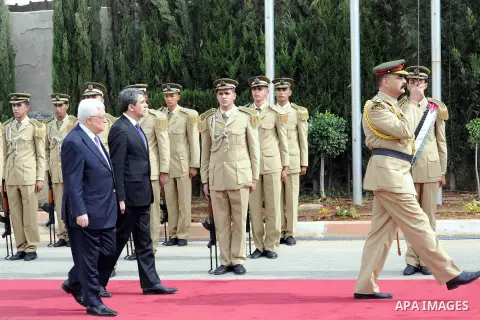 Palestinian President Mahmoud Abbas, left, and Bulgarian President Rosen Plevneliev, review an honor guard prior to their meeting in the West Bank city of Ramallah on October 24, 2012. Plevneliev is on an official visit...