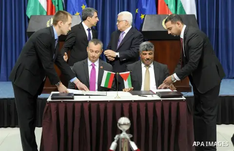 Palestinian president Mahmud Abbas (back right) and Bulgarian President Rosen Plevneliev attend signing cooperation agreements, in the West Bank city of Ramallah on October 24, 2012. Plevneliev is on an official visit to...