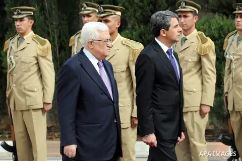 Palestinian President Mahmoud Abbas, left, and Bulgarian President Rosen Plevneliev, review an honor guard prior to their meeting in the West Bank city of Ramallah on October 24, 2012. Plevneliev is on an official visit...