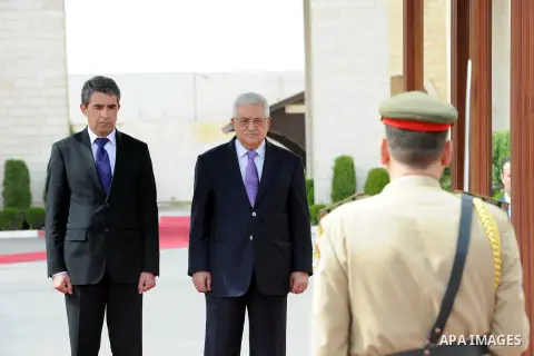 Palestinian President Mahmoud Abbas, right, and Bulgarian President Rosen Plevneliev, review an honor guard prior to their meeting in the West Bank city of Ramallah on October 24, 2012. Plevneliev is on an official visit...
