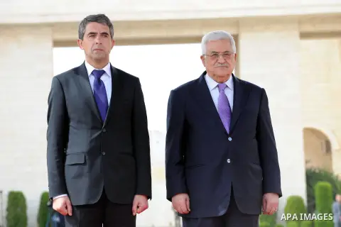 Palestinian President Mahmoud Abbas, right, and Bulgarian President Rosen Plevneliev, review an honor guard prior to their meeting in the West Bank city of Ramallah on October 24, 2012. Plevneliev is on an official visit...
