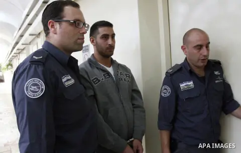 A Palestinian youth arrives to an Israeli court that was due to rule on his participation in al-Aqsa mosque demonstrations against an anti-Islam film made in the U.S. mocking Prophet Mohammad, in Jerusalem, Oct. 24, 2012...