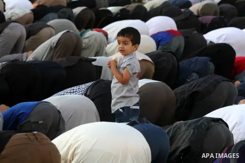 Palestinians attend Eid Al-Adha prayers on the first day of the Muslim holiday, at the Palestine Stadium in Gaza City, on October 26, 2012. Muslims around the world celebrate Eid al-Adha to mark the end of the haj by sla...