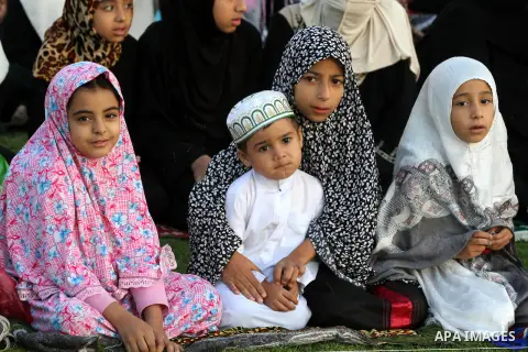 Palestinians attend Eid Al-Adha prayers on the first day of the Muslim holiday, at the Palestine Stadium in Gaza City, on October 26, 2012. Muslims around the world celebrate Eid al-Adha to mark the end of the haj by sla...