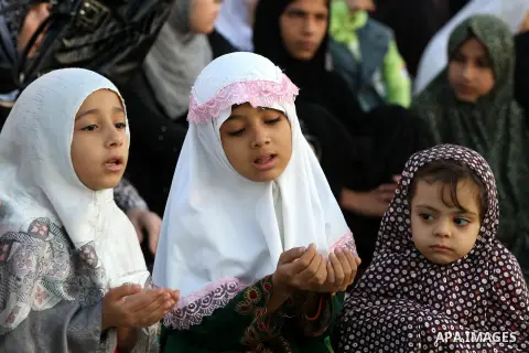 Palestinians attend Eid Al-Adha prayers on the first day of the Muslim holiday, at the Palestine Stadium in Gaza City, on October 26, 2012. Muslims around the world celebrate Eid al-Adha to mark the end of the haj by sla...