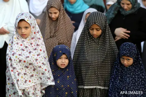 Palestinians attend Eid Al-Adha prayers on the first day of the Muslim holiday, at the Palestine Stadium in Gaza City, on October 26, 2012. Muslims around the world celebrate Eid al-Adha to mark the end of the haj by sla...
