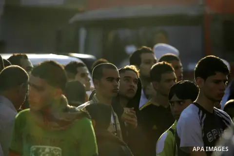 Palestinians slaughter a calf and sheep on the first day of the Muslim holiday of Eid al-Adha in Rafah in the southern Gaza Strip Oct. 26, 2012. Muslims around the world celebrate Eid al-Adha to mark the end of the haj b...