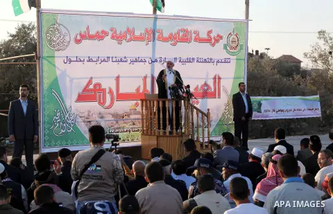 Palestinian Prime Minister in Gaza, Ismail Haniya delivers a speech during a mass prayer on the first day of the Muslim holiday of Eid al-Adha, at al-Nusairat, in the central Gaza Strip, on October 26, 2012. Muslims arou...