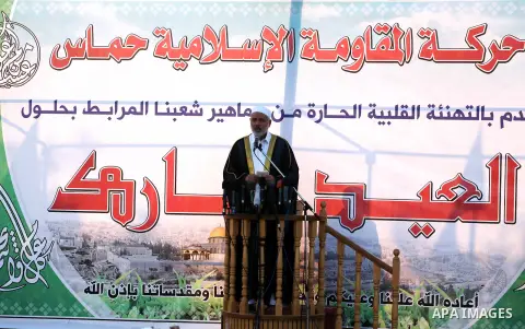 Palestinian Prime Minister in Gaza, Ismail Haniya delivers a speech during a mass prayer on the first day of the Muslim holiday of Eid al-Adha, at al-Nusairat, in the central Gaza Strip, on October 26, 2012. Muslims arou...