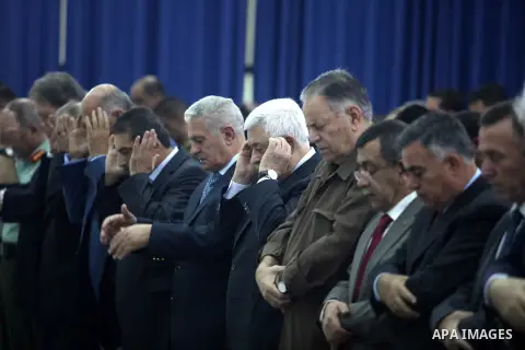Palestinian president Mahmud Abbas, and other Palestinian officials perform the early morning Eid al-Adha prayer at the Palestinian Authority headquarters in the West Bank city of Ramallah on October 26, 2012. Muslims wo...