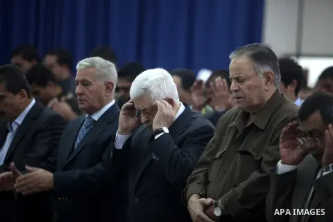 Palestinian president Mahmud Abbas, and other Palestinian officials perform the early morning Eid al-Adha prayer at the Palestinian Authority headquarters in the West Bank city of Ramallah on October 26, 2012. Muslims wo...