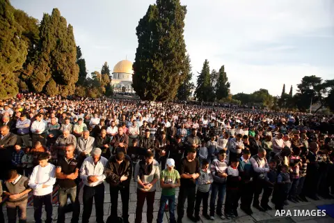 Palestinian Muslim worshippers pray at the al-Aqsa Mosque compound in Jerusalem's old city on the first day of Eid al-Adha on October 26, 2012 as Muslims worldwide commemorate Eid al-Adha, or the Feast of the Sacrifice,...