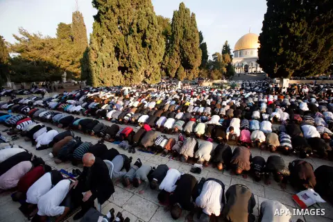 Palestinian Muslim worshippers pray at the al-Aqsa Mosque compound in Jerusalem's old city on the first day of Eid al-Adha on October 26, 2012 as Muslims worldwide commemorate Eid al-Adha, or the Feast of the Sacrifice,...