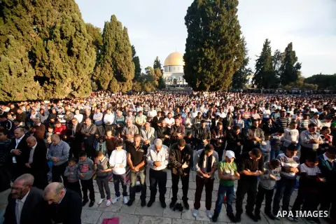 Palestinian Muslim worshippers pray at the al-Aqsa Mosque compound in Jerusalem's old city on the first day of Eid al-Adha on October 26, 2012 as Muslims worldwide commemorate Eid al-Adha, or the Feast of the Sacrifice,...