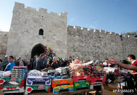 Palestinian vendors sell toys outside al-Aqsa Mosque compound in Jerusalem's Old city, on the first day of Eid al-Adha October 26, 2012. Muslims around the world celebrate Eid al-Adha to mark the end of the Haj by slaugh...