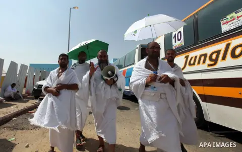 Muslim pilgrims stand on Mount Mercy on the plains of Arafat during the peak of the annual haj pilgrimage near the holy city of Mecca October 26, 2012. Nearly 3 million Muslim pilgrims started the first phase of the annu...