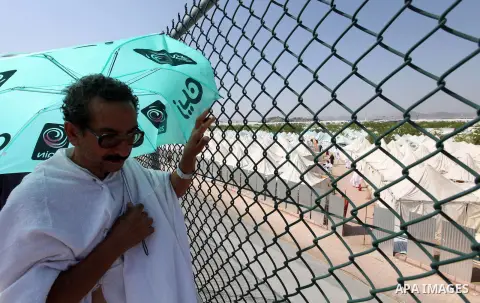 A Muslim pilgrim stands on Mount Mercy on the plains of Arafat during the peak of the annual haj pilgrimage near the holy city of Mecca October 26, 2012. Nearly 3 million Muslim pilgrims started the first phase of the an...