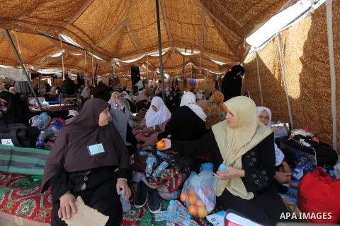 Muslim pilgrims rest on Mount Mercy on the plains of Arafat during the peak of the annual haj pilgrimage near the holy city of Mecca October 26, 2012. Nearly 3 million Muslim pilgrims started the first phase of the annua...