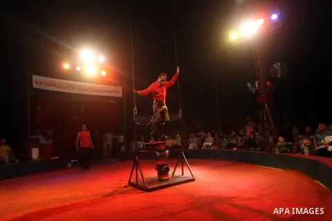 Palestinians watch members of the Egyptian National Circus, perform in Gaza City, Oct. 27, 2012. The Egyptian National Circus put on its first show of a month-long visit to the impoverished coastal territory, a sign of w...