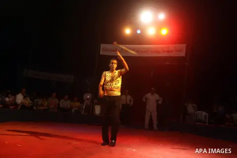 Palestinians watch members of the Egyptian National Circus, perform in Gaza City, Oct. 27, 2012. The Egyptian National Circus put on its first show of a month-long visit to the impoverished coastal territory, a sign of w...