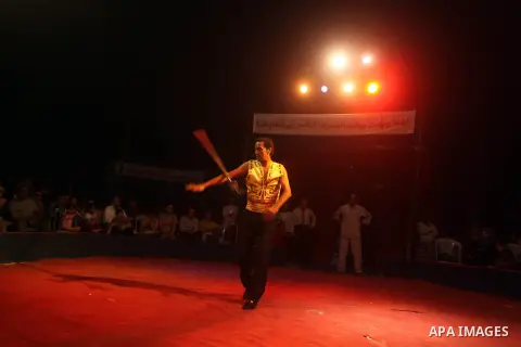 Palestinians watch members of the Egyptian National Circus, perform in Gaza City, Oct. 27, 2012. The Egyptian National Circus put on its first show of a month-long visit to the impoverished coastal territory, a sign of w...