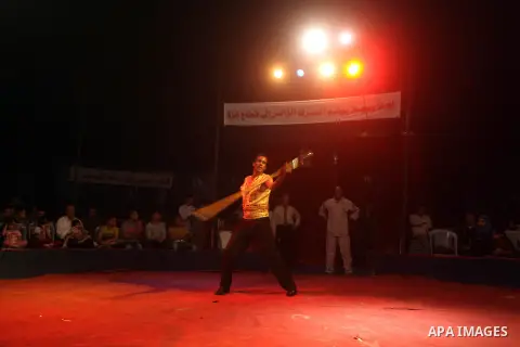 Palestinians watch members of the Egyptian National Circus, perform in Gaza City, Oct. 27, 2012. The Egyptian National Circus put on its first show of a month-long visit to the impoverished coastal territory, a sign of w...
