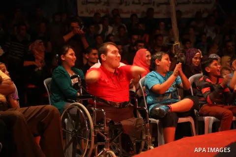 Palestinians watch members of the Egyptian National Circus, perform in Gaza City, Oct. 27, 2012. The Egyptian National Circus put on its first show of a month-long visit to the impoverished coastal territory, a sign of w...