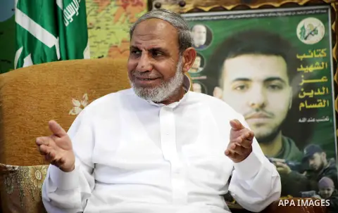 Palestinian Hamas leader Mahmoud al-Zahar recieves congratulations in Eid al-Adha at his house in Gaza city, on October 27, 2012. Muslims around the world celebrate Eid al-Adha to mark the end of the haj by slaughtering...