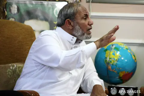 Palestinian Hamas leader Mahmoud al-Zahar recieves congratulations in Eid al-Adha at his house in Gaza city, on October 27, 2012. Muslims around the world celebrate Eid al-Adha to mark the end of the haj by slaughtering...