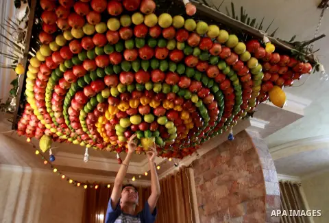 Palestinian Man from the ancient Samaritan community decorate a house, made from fresh fruit for the holy day of the Tabernacles or Sukkot in Mount Gerizim near the West Bank city of Nablus ,October 28, 2012. Photo by Ne...