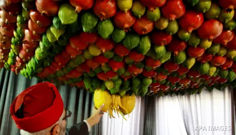 Palestinian Man from the ancient Samaritan community decorate a house, made from fresh fruit for the holy day of the Tabernacles or Sukkot in Mount Gerizim near the West Bank city of Nablus ,October 28, 2012. Photo by Ne...