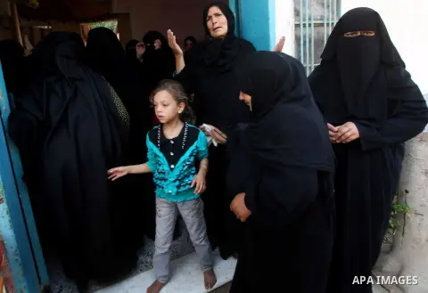 Relatives of Palestinian Suleiman al-Qarra mourn during his funeral in Khanions, in the Southern Gaza Strip, on October 28, 2012. Israel killed the Hamas gunman it accused of preparing to fire a rocket from the Gaza Stri...