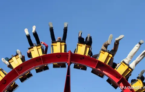 Palestinians enjoy themselves at an amusement park in Gaza City as the Muslim world celebrates the third day of the Eid al-Adha holiday on October 28, 2012. Eid al-Adha or "Feast of the Sacrifice" marks the end of the an...