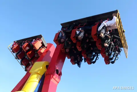 Palestinians enjoy themselves at an amusement park in Gaza City as the Muslim world celebrates the third day of the Eid al-Adha holiday on October 28, 2012. Eid al-Adha or "Feast of the Sacrifice" marks the end of the an...