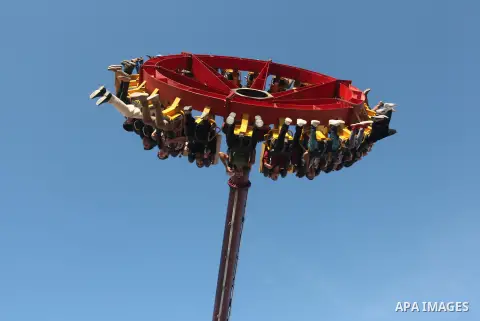 Palestinians enjoy themselves at an amusement park in Gaza City as the Muslim world celebrates the third day of the Eid al-Adha holiday on October 28, 2012. Eid al-Adha or "Feast of the Sacrifice" marks the end of the an...