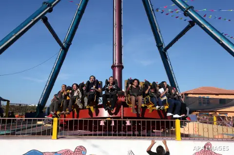 Palestinians enjoy themselves at an amusement park in Gaza City as the Muslim world celebrates the third day of the Eid al-Adha holiday on October 28, 2012. Eid al-Adha or "Feast of the Sacrifice" marks the end of the an...