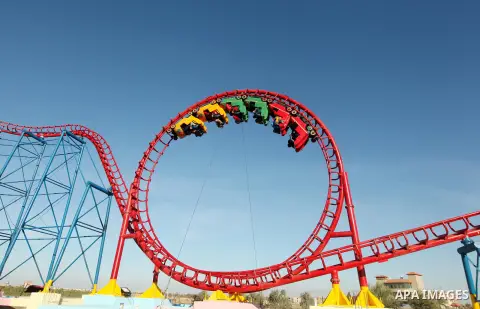 Palestinians enjoy themselves at an amusement park in Gaza City as the Muslim world celebrates the third day of the Eid al-Adha holiday on October 28, 2012. Eid al-Adha or "Feast of the Sacrifice" marks the end of the an...