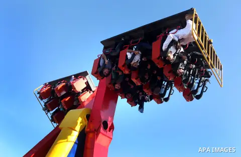 Palestinians enjoy themselves at an amusement park in Gaza City as the Muslim world celebrates the third day of the Eid al-Adha holiday on October 28, 2012. Eid al-Adha or "Feast of the Sacrifice" marks the end of the an...