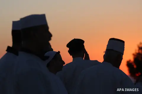 Members of the ancient Samaritan community, wrapped in a prayer shawl participate in the pilgrimage for the holy day of the Tabernacles or Sukkot at the religion's holiest site on the top of Mount Gerizim near the West B...